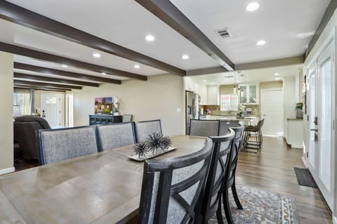 POV from the dining room towards the kitchen and laundry room.