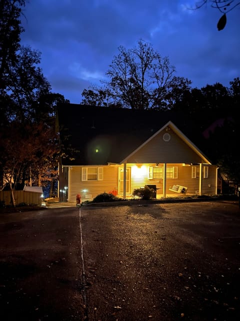 Front view of our lake house getaway at night