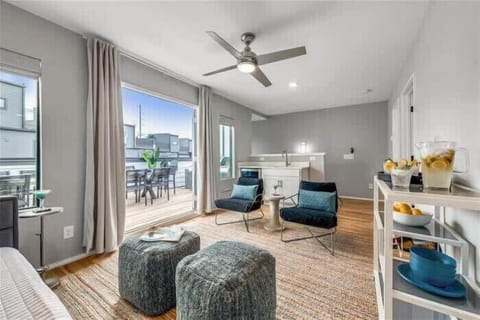 Second living area with access to roof deck, wine fridge and wet bar.