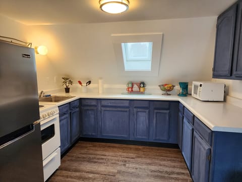 2nd Level Kitchen, adjacent to queen bedroom #5. Open with lake views