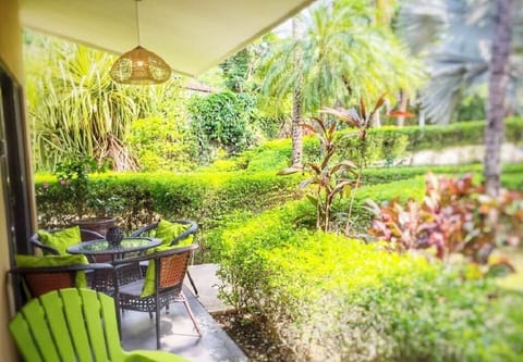 Our front patio is steps to the communal pool and offers a lush garden. 