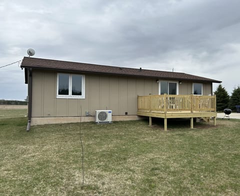 Back of the house with a new deck 