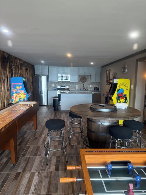 Amazing game room. Shuffle board, video games, foosball. No boredom here.