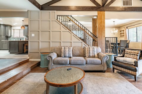 The living room features a contemporary interior design.