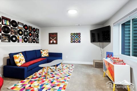  Enjoy fun-filled nights in this cozy family room retreat. With plush seating and a large TV, this space is perfect for movie nights and game nights.