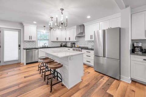 Fully equipped kitchen featuring modern appliances, ample counter space, and all the essentials for cooking and dining. Perfect for preparing home-cooked meals and enjoying quality time with family and friends.