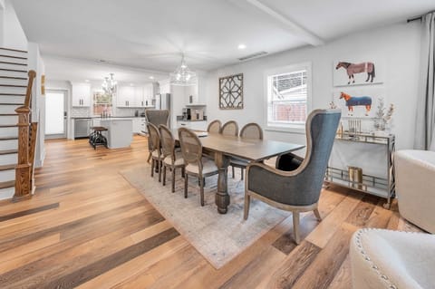 Inviting dining area designed for shared meals and great conversations. Features a spacious table, comfortable seating, and warm lighting, perfect for family dinners or casual gatherings with friends.