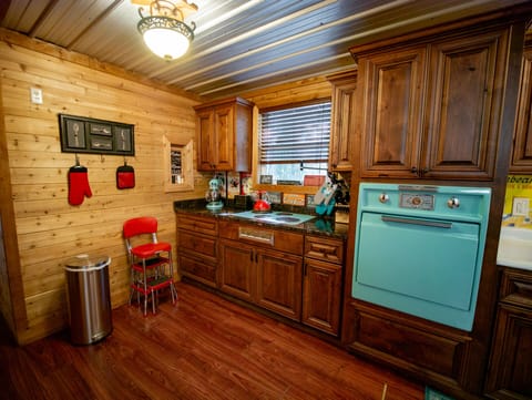 This retro kitchen is a fun place to be.  room for all to help.