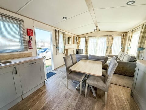 Prepare your favourite UK holiday meals while still being part of the conversation in this convenient open plan caravan kitchen.