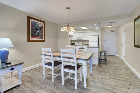 Gather round for a meal or a game of cards at the dining table with seating for 4 in the main living space.