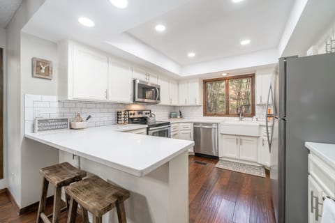 Kitchen bar area with seating for 2