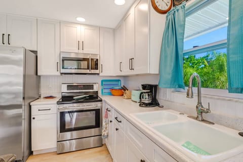 The kitchen comes well equipped with full size oven, microwave, dishwasher and refridgerator/freezer.