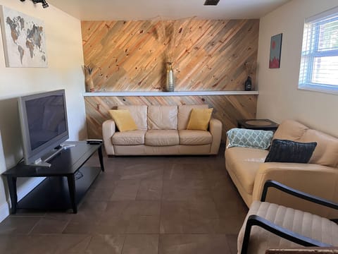 Sunken living room. Roku enabled TV. 