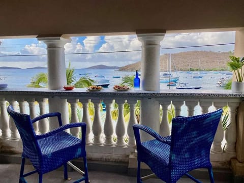 
Swivel, Padded Bar Chairs in Front of a Full-Length, Custom Poured Bar Top.