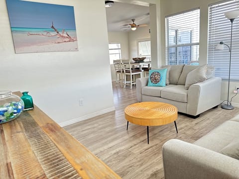 Living room looking into kitchen and Dining