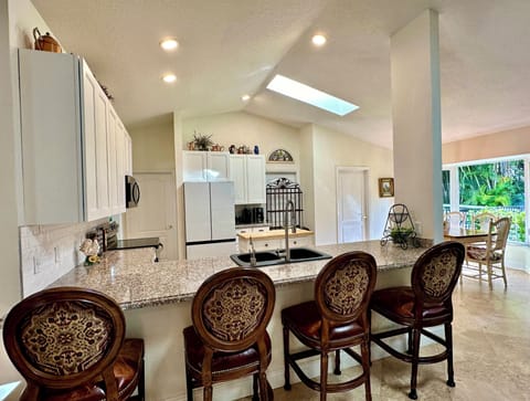 4 swivel bar stools with distressed leather seats