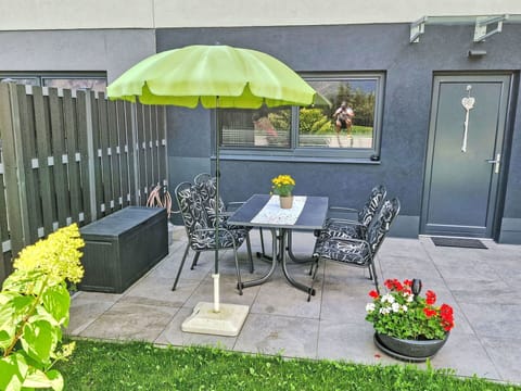 Plant, Table, Flower, Furniture, Property, Building, Flowerpot, Chair, Door, Shade