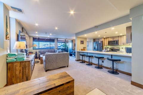 Open living area with new carpet, remodeled kitchen and panoramic views.