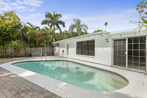 Heated Pool: Day or night, the private and fenced pool is the perfect place to rejuvenate and make memories. Watch the planes take off above from Peter O. Knight airport during the day, while string lights add charm as the sun sets at night.
