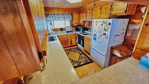 Kitchen has double sink, Keurig, coffee maker, toaster, other small appliances