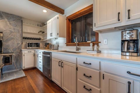 Stainless steel appliances and a large farmhouse sink make your visit comfortable and functional.