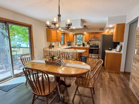 Kitchen and dining area, sliding glass door faces the lake.