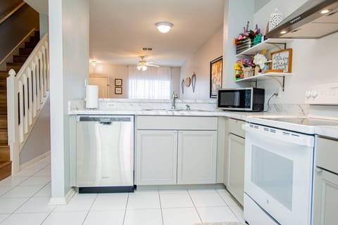 Kitchen area with dishwasher, range, microwave & refrigerator for your convenience!