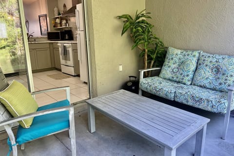 Outdoor patio area with sliding glass door entry into the kitchen!