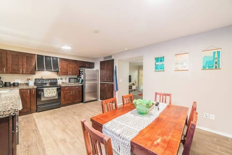 Indulge in culinary luxury with our expansive, wooden-themed kitchen - where every detail is designed for grandeur and elegance.