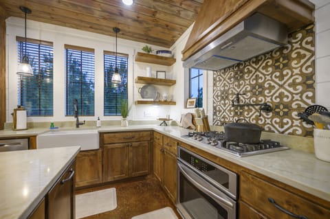 Equipped with a gas stove and an oven.