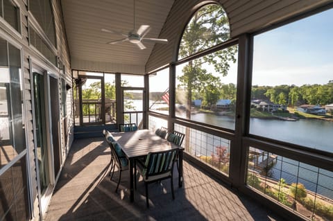 Upper deck with screened in porch - wonderful place to enjoy a meal!