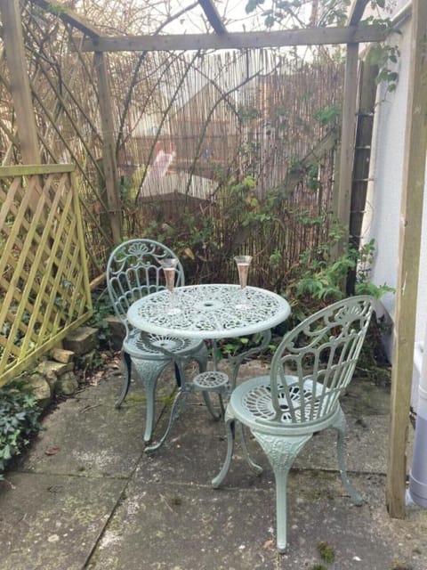 Outdoor furniture is provided in the private garden 