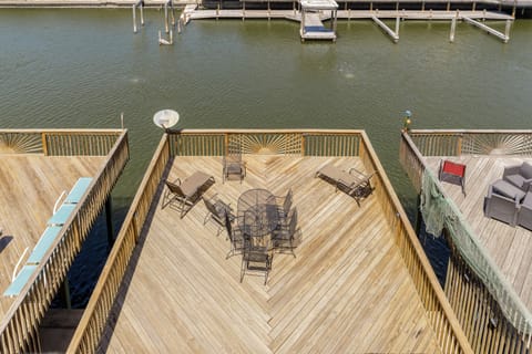 Your private waterfront deck offers stunning lake views with dining space and lounge chairs for the perfect lakeside getaway.