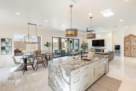 Kitchen View of Patio - View from the kitchen showing you the open sliding doors to access the back patio.