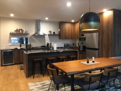 Table with seating for 8, additional 4 seats at the island.