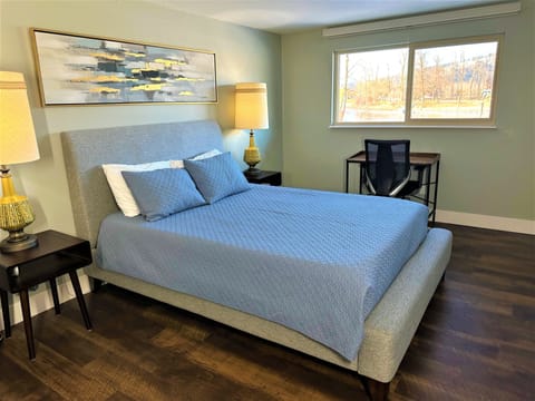 Master Bedroom, queen bed, writing desk and river view.