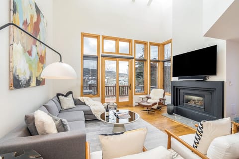This family friendly, two-story home boasts an open concept living/eating area, fireplace, and deck with private hot tub.