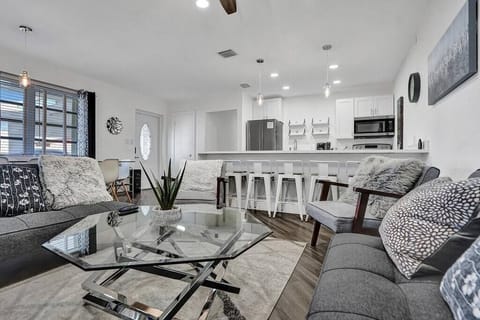 This is the living room. The space is cozy. It is also comfortable. 