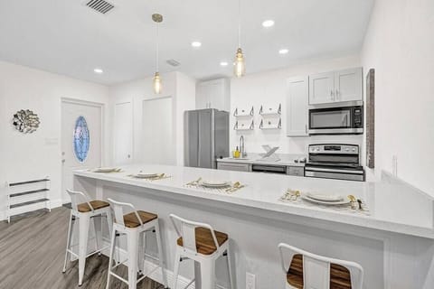 You will love the light fixtures in the kitchen. They are simple and modern. 