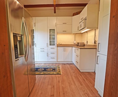 Kitchen and pantry are outfitted with top appliances and all the conveniences