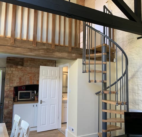 Spiral staircase to mezzanine floor