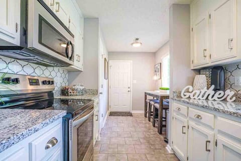 Kitchen. Beautiful back splash, stainless steel hardware, granite counter tops. 