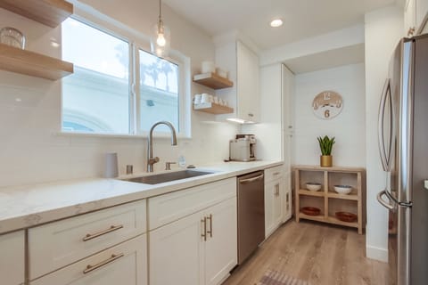 Modern kitchen with upgraded stainless appliances.