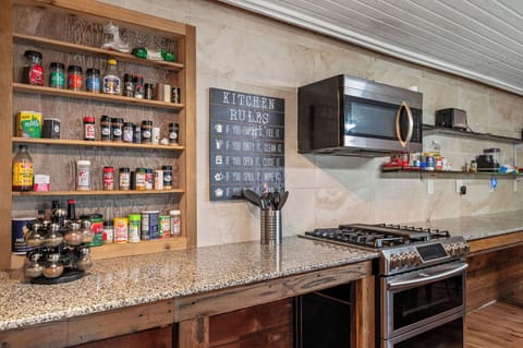 Kitchen spices, stove top (gas), microwave, toaster