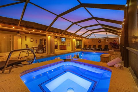 spacious heated pool/spa in a screened in cage.