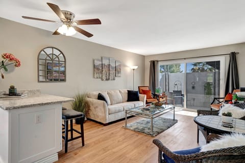 Living room and dining areas, sliding door to a private patio.