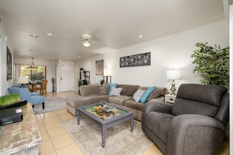 Living room has a sofa bed couch and power recliner.