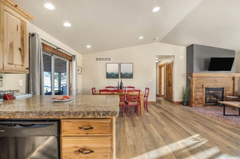 Dining table extends to seat 8 people, 3 bar stools at the counter and then coffee table space for the little ones. High chair available but not pictured.