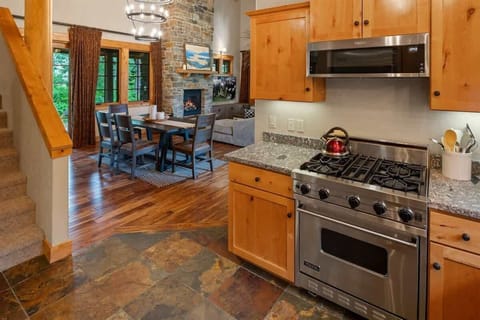 View from the kitchen into the dining and living room areas.