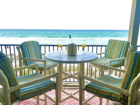 Outdoor covered deck with direct unobstructed view of gulf.